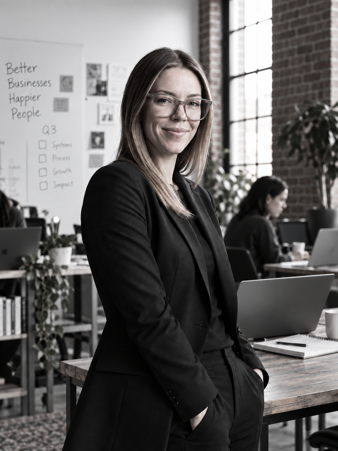 Carley, founder of The Steady System, in her workspace